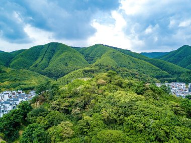 Landscape of green hills forest and blue sky and white clouds on the outskirts of Guangxi, China