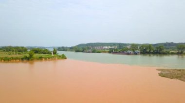 The unique landscape of Sanjiangkou in Nanning, Guangxi, China, where two rivers and two colors meet