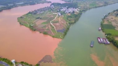 The unique landscape of Sanjiangkou in Nanning, Guangxi, China, where two rivers and two colors meet