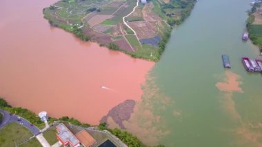 The unique landscape of Sanjiangkou in Nanning, Guangxi, China, where two rivers and two colors meet