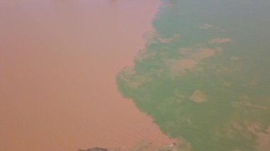 The unique landscape of Sanjiangkou in Nanning, Guangxi, China, where two rivers and two colors meet