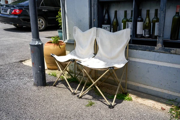 Two casual folding chairs in outdoor bar