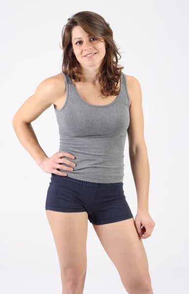 Healthy fitness woman with shorts and singlet — Stock Photo, Image