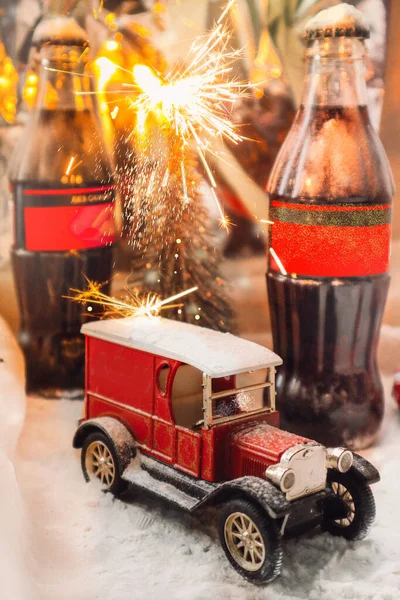 beautiful red car and Christmas atmosphere,snow and fireworks