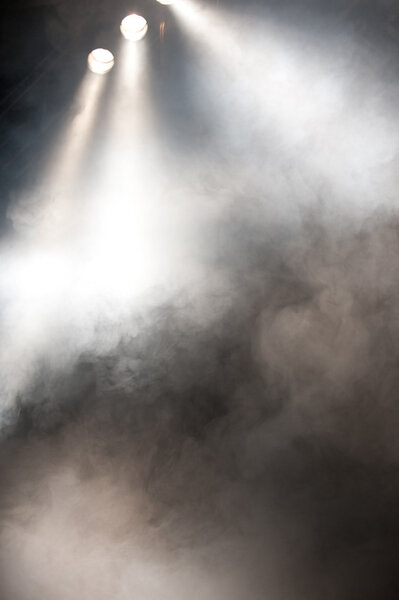 Spotlights Shining Through Smoke