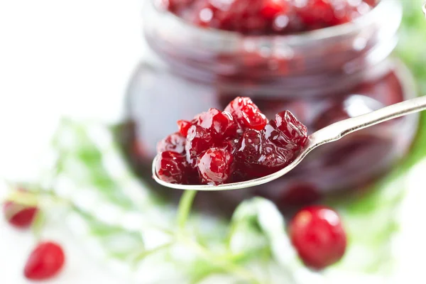 Cranberry sauce in glass jar — Stock Photo, Image