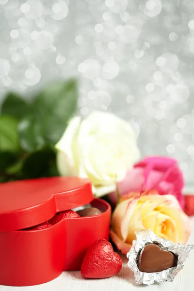 Gift box, chocolate and flowers — Stock Photo, Image