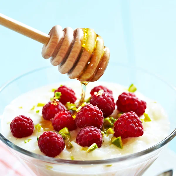 Rice pudding with raspberry — Stock Photo, Image