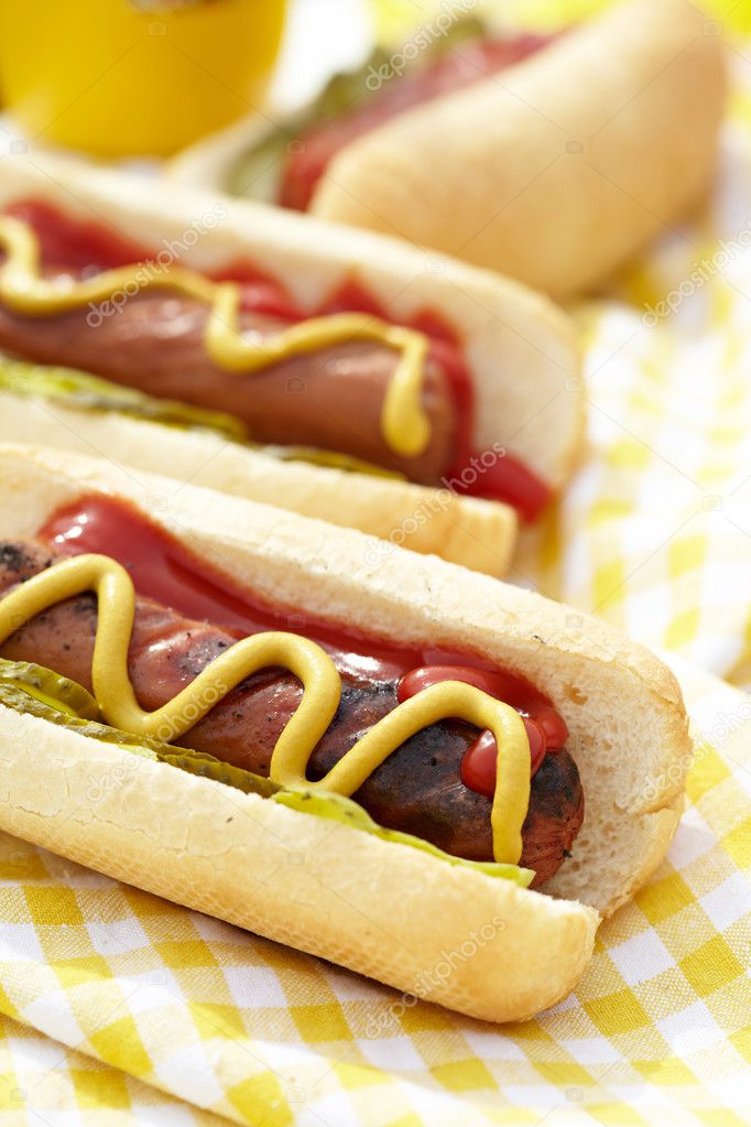 Grilled hot dogs with mustard, ketchup and relish