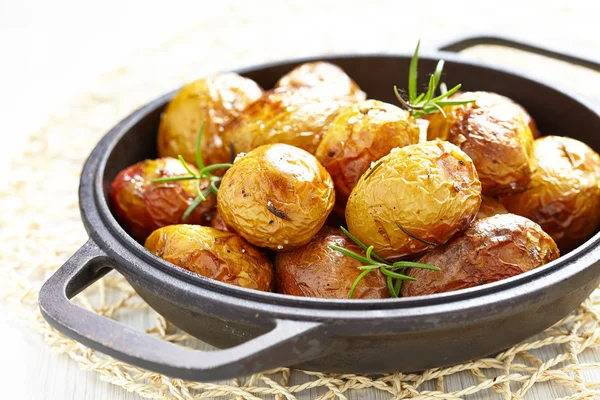 Baked potatoes with rosemary — Stock Photo, Image