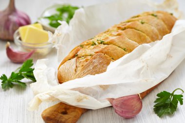 Baked garlic bread with herbs clipart