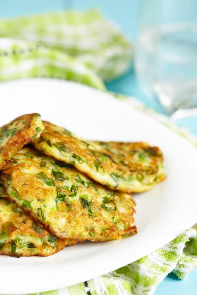 Green pancakes with zucchini and herbs — Stock Photo, Image