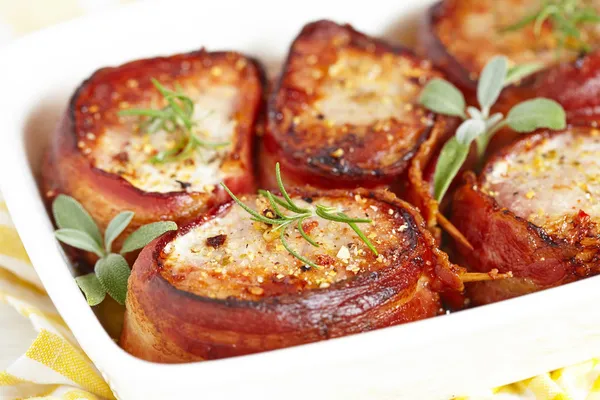Roasted pork steak wrapped in bacon — Stock Image Roasted pork steak wrapped in bacon Royalty Free Stock Photos