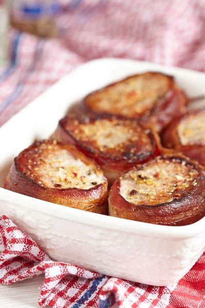 Roasted pork steak wrapped in bacon — Stock Photo, Image