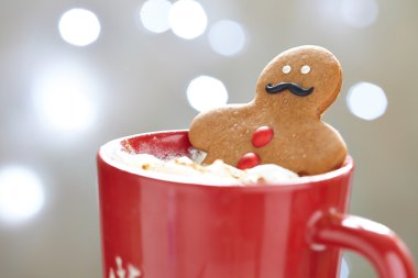 Gingerbread man in hot chocolate clipart