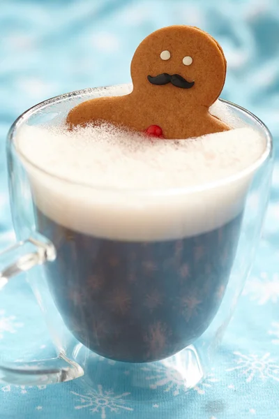 Gingerbread man in hot chocolate — Stock Photo, Image