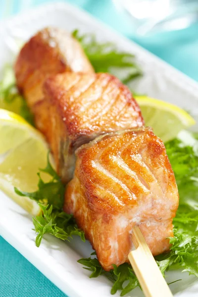 Delicious roasted salmon on skewers — Stock Photo, Image