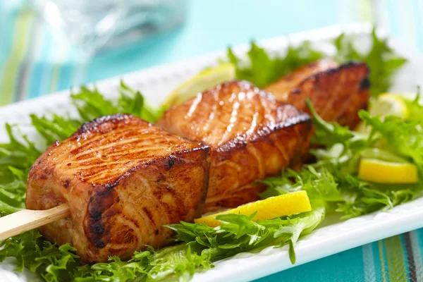 Delicious roasted salmon on skewers — Stock Photo, Image