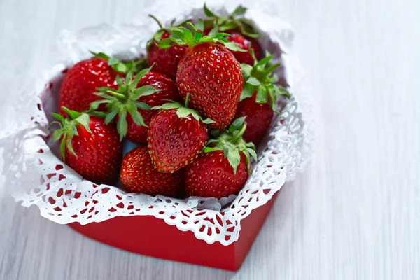 Fresh strawberries in a heart shaped box — Stock Photo, Image