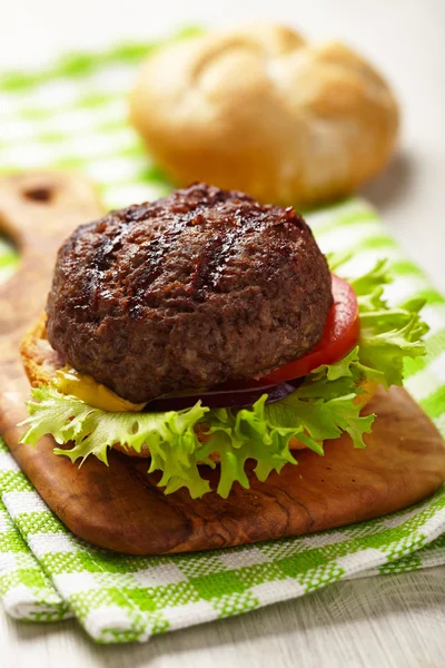 Homemade grilled hamburger on plate — Stock Photo, Image