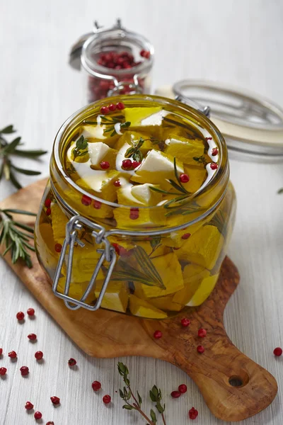 Marinated cheese in olive oil — Stock Photo, Image