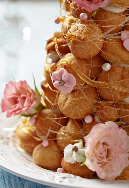 Croquembouche with Pink and White Frosting Roses