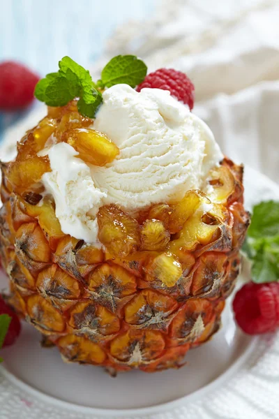 Fruit sorbet ice cream in small pineapple — Stock Photo, Image