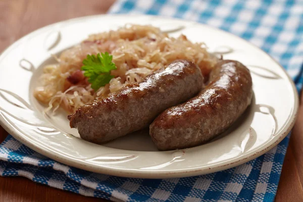 Grilled bavarian sausages with sauerkraut — Stock Photo, Image