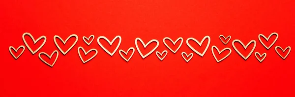 Valentine wooden hearts on red background — Φωτογραφία Αρχείου