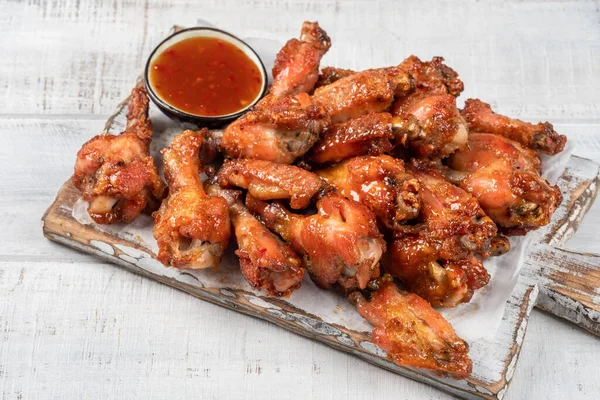 Chicken wings with sriracha sauce Stock Photo