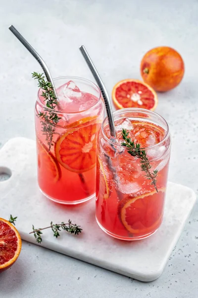 Blood Orange Margarita cocktail with ice and thyme Royalty Free Stock Photos
