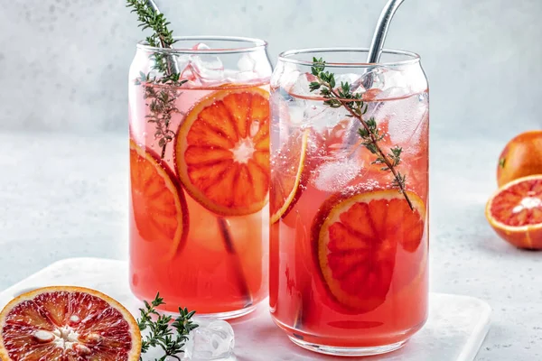 Blood Orange Margarita cocktail with ice and thyme Stock Image