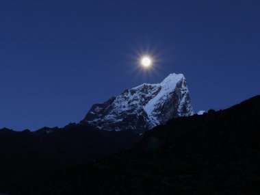 Full moon over the Himalayas clipart