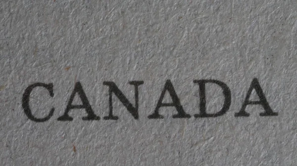 Das Wort Kanada Ist Auf Ein Blatt Papier Gedruckt Großaufnahme — Stockfoto