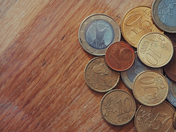 A lot of euro cents of different denominations, a close-up shot. Space for text.