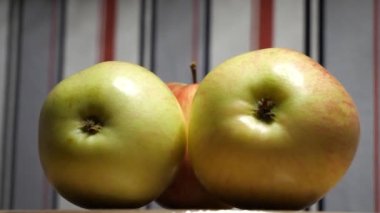 Three big apples, close-up video. Fruit rotation.
