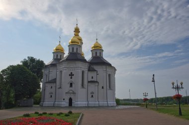 Cloudy sky over the ancient Church of St. Catherine in the city of Chernihiv. An example of baroque architecture. Church is distinguished by its five gold domes.