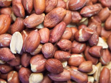 Kavrulmuş kabuksuz fıstık makrosu, arka plan olarak da fıstık.