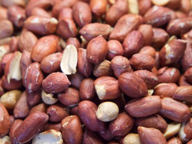 Kabuğu soyulmamış fıstık makrosu, arka plan olarak da fıstık. Yer fıstığı dokusu