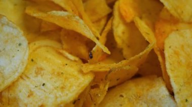 Salted potato chips close-up, full frame, video 4k. Potato chips rotating video