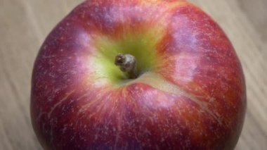 Video with a rotating red apple. One apple.