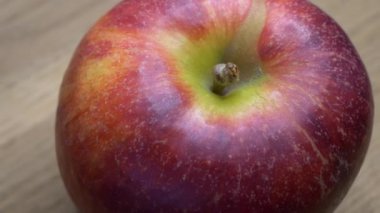 Beautiful apple close-up. Video with a rotating red apple.