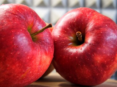 Several ripe red apples, macro shot. Beautiful fruits.