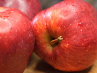 Three big red apples, a close-up shot. Delicious ripe fruits, macro.