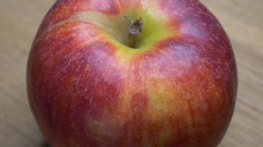 Beautiful apple close-up. Video with a rotating apple.