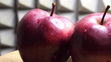 Big red apples of the Red Chief variety. Drops of water on the apple peel. Apple close-up. Full hd.