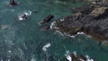 Atlantic waves and rocks. Seaside landscape. Beautiful area near the coast of West Cork, Ireland. Aerial video in full hd.