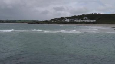 Cloudy, Atlantic Ocean, coast of Ireland. Tidal sea waves. Clonakilty Bay on a cool day.
