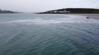 Cloudy sky over the waters of the Atlantic Ocean, the southern coast of Ireland. Tidal sea waves. Clonakilty Bay on a cool day.