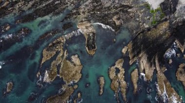 The picturesque seaside of Ireland, turquoise waters of the Atlantic Ocean. Beautiful sea cliffs, top view.